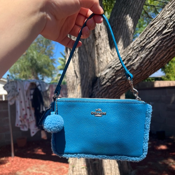 Coach Handbags - Coach Peacock Sherling Wristlet with Pom-Pom